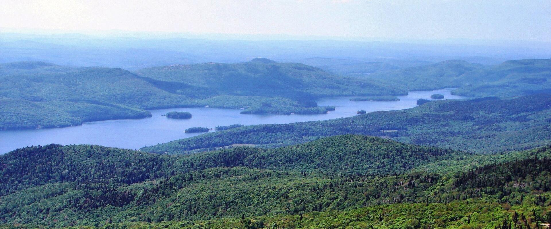 Lac Tremblant stretching between the forested Laurentian hills