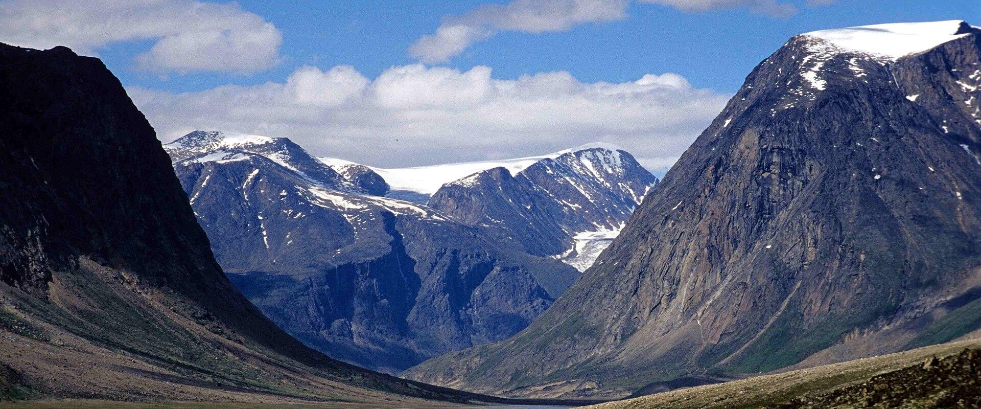 Snow-capped peaks above a glacial valley in Auyuittuq National Park, Nunavut