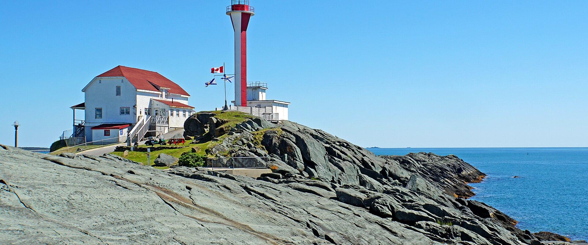 Cape Forchu Lighthouse on the rocky coast near Yarmouth, Nova Scotia