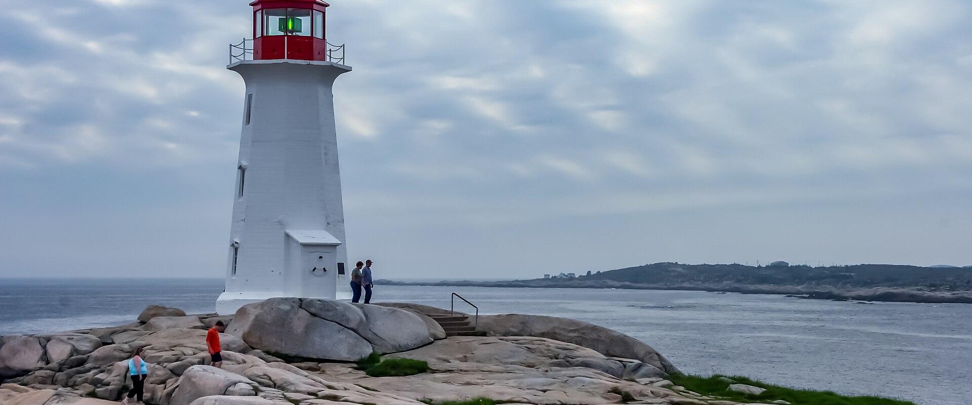 Peggys Point Lighthouse on the granite shore of Peggys Cove, Nova Scotia