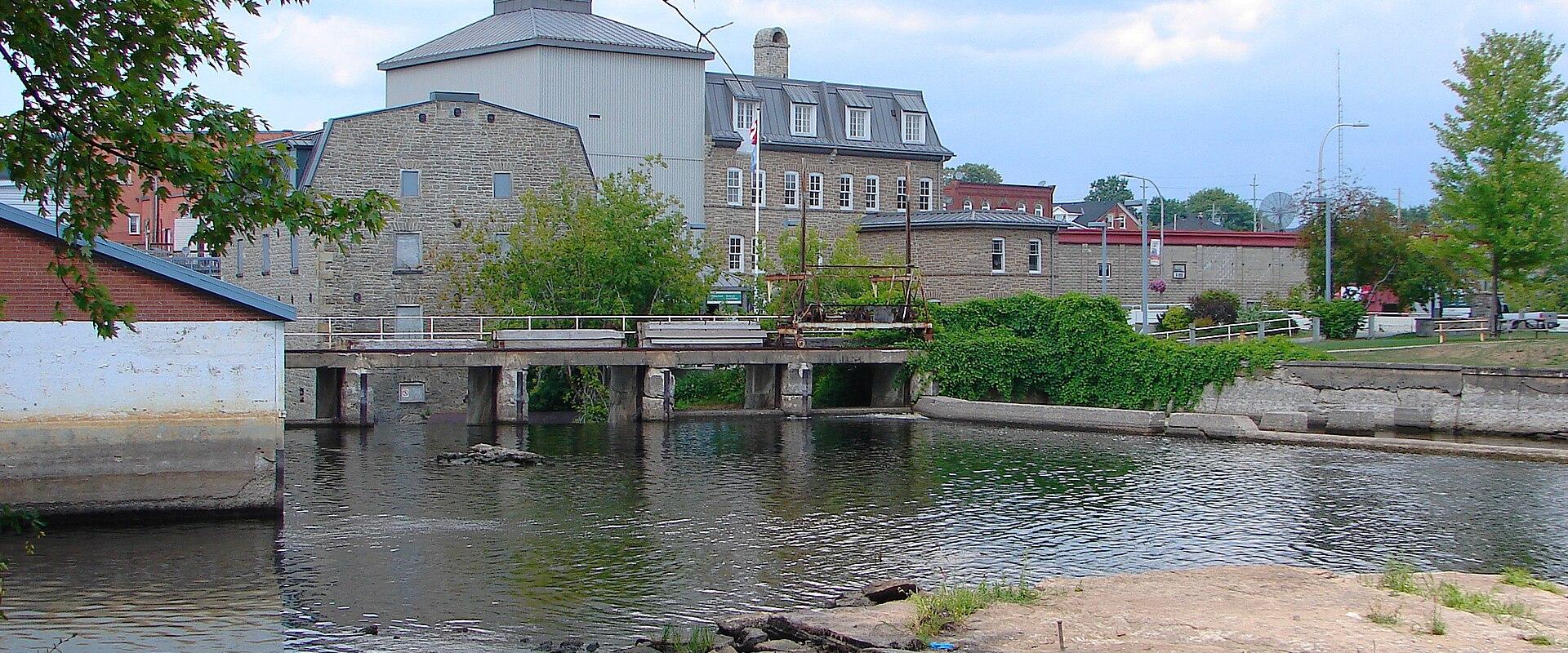The Rideau waterway at Smiths Falls with the town's heritage buildings on the far bank.