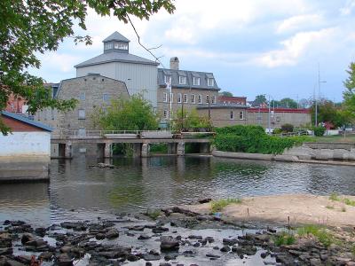The Rideau waterway at Smiths Falls with the town's heritage buildings on the far bank.