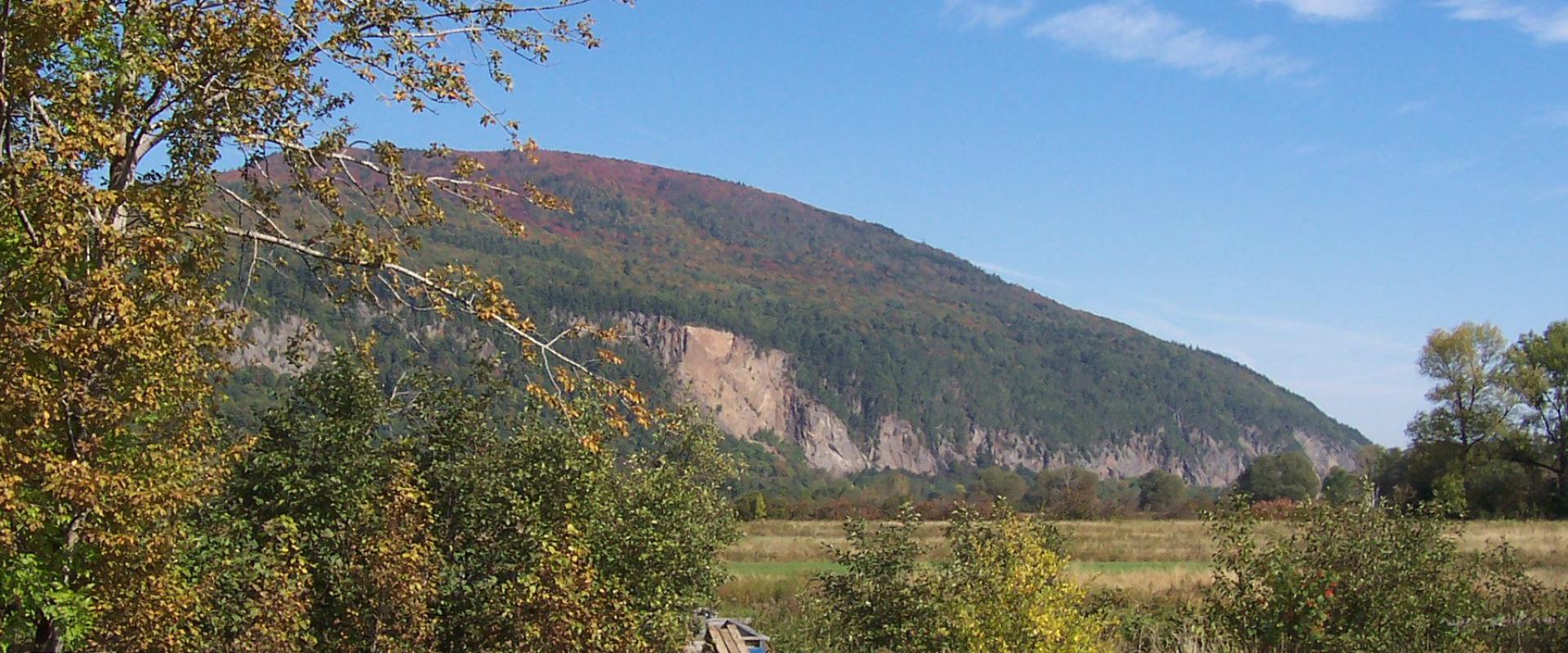 The cape rising above the meadows of Cap Tourmente National Wildlife Area