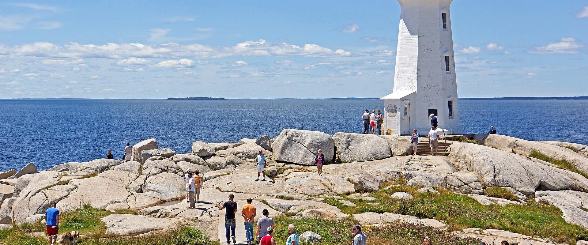 Peggy's Cove Lighthouse on its granite outcrop above the Atlantic, Nova Scotia
