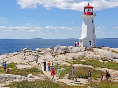 Peggy's Cove Lighthouse on its granite outcrop above the Atlantic, Nova Scotia