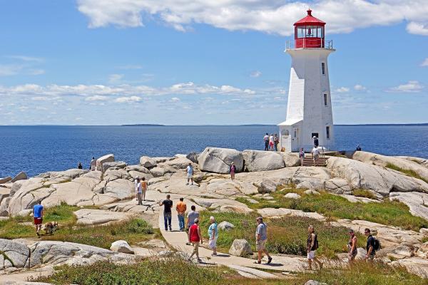 Peggy's Cove Lighthouse on its granite outcrop above the Atlantic, Nova Scotia