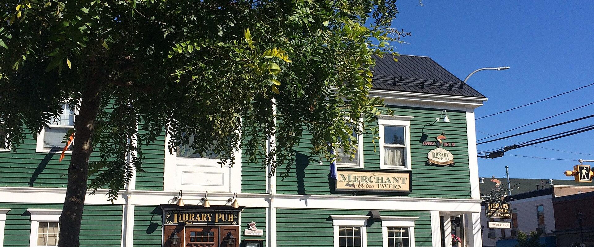 Historic green clapboard building on Main Street, Wolfville