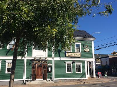 Historic green clapboard building on Main Street, Wolfville