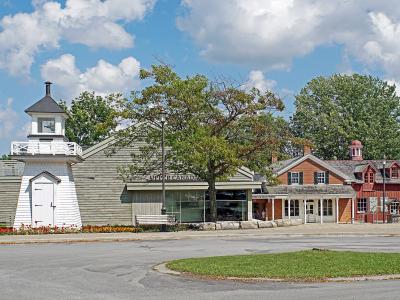 Historic buildings and a small lighthouse near Morrisburg on the St. Lawrence