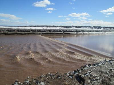 The tidal bore rolling up the Petitcodiac River at Moncton