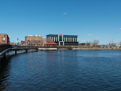 Lac des Nations and the Sherbrooke skyline under a blue sky
