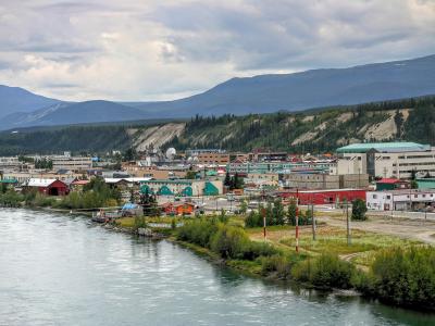 The Yukon River flowing past Whitehorse beneath the hills