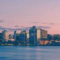 The Halifax skyline across the harbour at sunset
